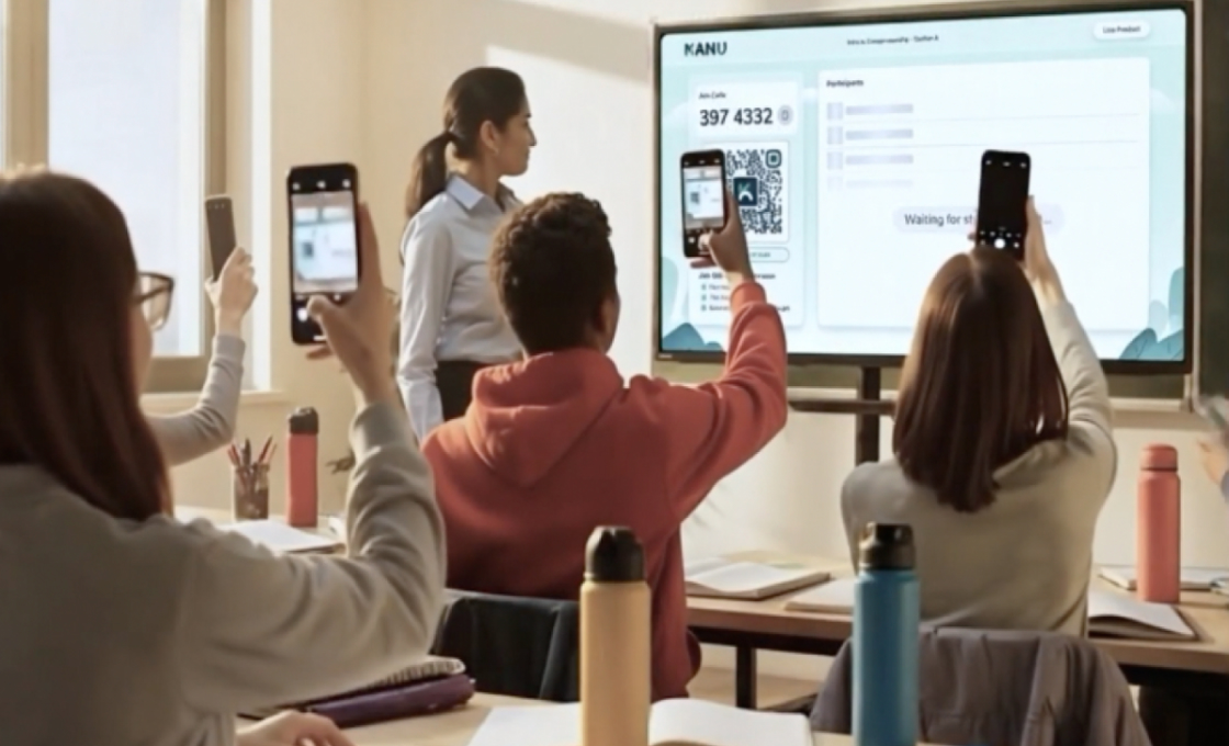 Students in a classroom holding up phones to scan a join code shown on the teacher's wall display.